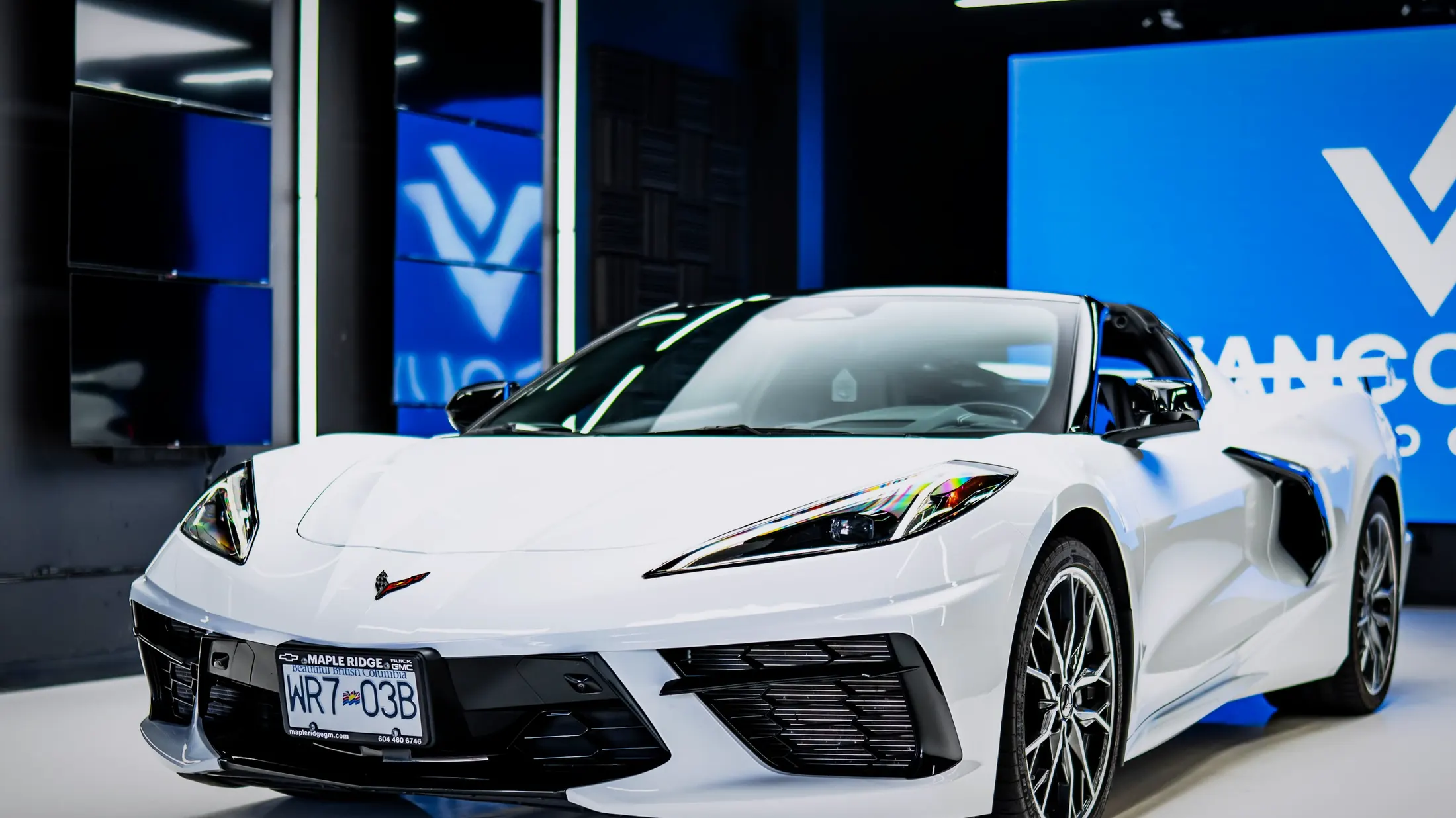 Chevrolet Corvette C8 Convertible with the roof down on Marine Drive in West Vancouver, ocean in the background